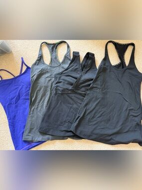 Luluemon Tops (4 in total)…purple is size 4, black and gray are size 6